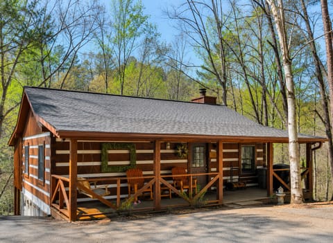 Authentic log cabin with covered porch for relaxing and grilling