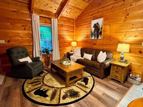 Cozy log cabin lounge with rustic charm and warm, inviting seating