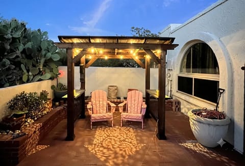 Private backyard patio with covered seating. 