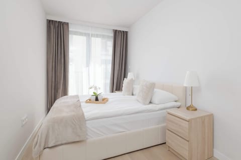 A comfortable bedroom with a large double bed and elegant décor. Soft lighting and neutral colors create a peaceful place to rest.