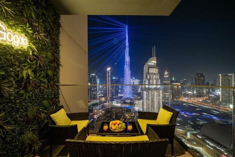 Relax on your private balcony with comfortable seating and a tea table while enjoying breathtaking night views of the Burj Khalifa and its spectacular light show—perfect for unwinding with a coffee or a peaceful evening under the Dubai skyline.