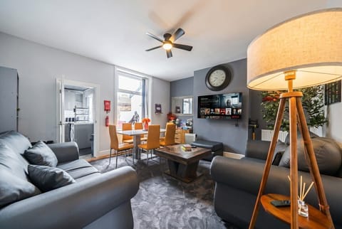Unwind on plush sofas with Netflix and dining space all in one bright lounge