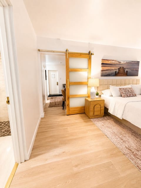 Luxury Suite, Multiple Beds, Non Smoking, Kitchenette | Desk, laptop workspace, blackout drapes, iron/ironing board