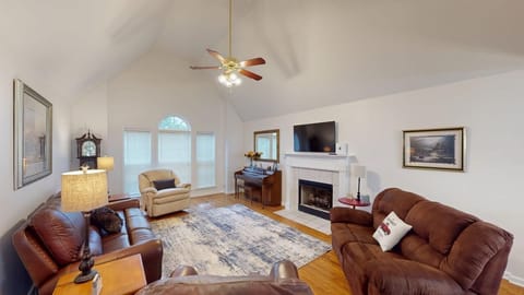 Living room with beautiful hardwood floors, a cozy gas fireplace, Smart TV