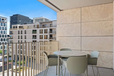 Private balcony with outdoor seating, perfect for morning coffee or relaxing after exploring Luxembourg City.