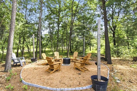 Unwind beneath the trees in a cozy outdoor gathering space made for fireside chats, laughter, and peaceful evenings in nature.