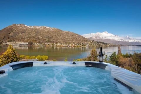 Private spa with panoramic lake and mountain views