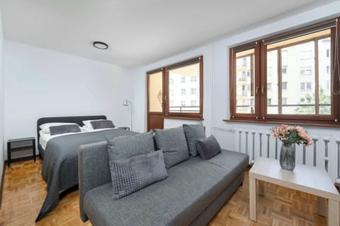 The cosy bedroom features a luxurious double bed and ample storage.