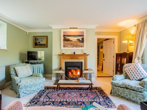 The tastefully decorated lounge is a wonderful place to wind down with the roaring open fire