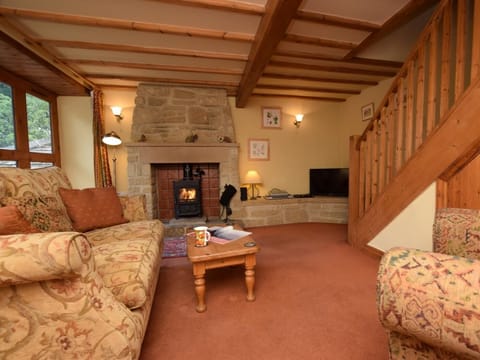 Charming room with cosy wood burning stove and beams