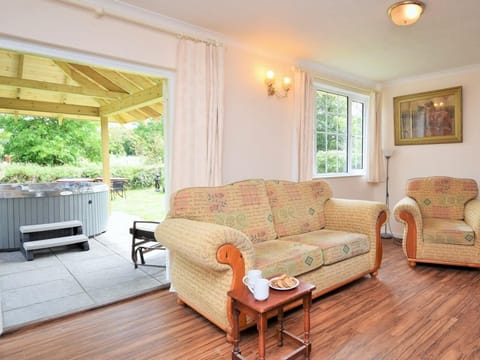 Lounge area with doors to the garden and hot tub