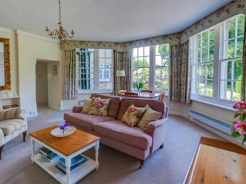 Lounge with large windows overlooking the gardens