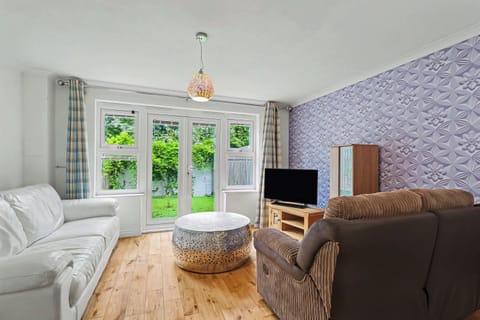 Spacious living room with access to a private garden.