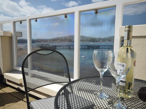 Unwind on the decking with a view across the bay