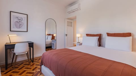 Unwind in a stylish, air-conditioned bedroom with soft tones, quality bedding, and a dedicated workspace for added comfort. #Bedroom #ComfortStay #ModernDesign #TravelPortugal #Portugal #PT #Cascais
