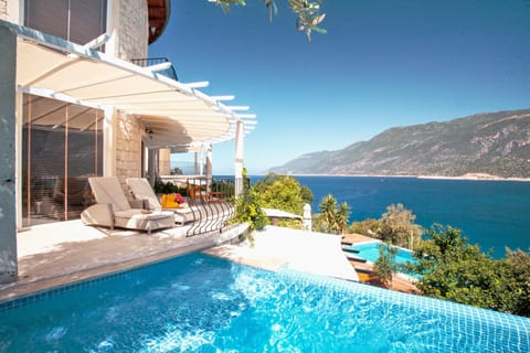 An infinity pool, open 8 AM to 8 PM, sun loungers