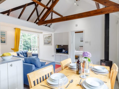 This pretty cottage has a contemporary feel with French doors to let the outside in