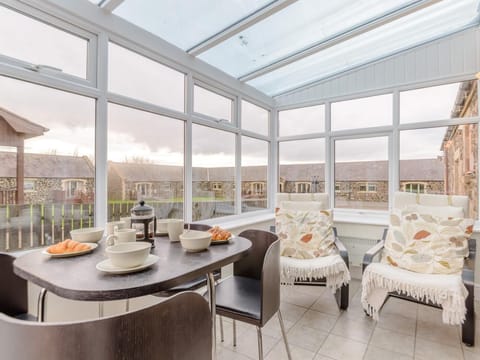 Enjoy a breakfast in the conservatory before heading to the beach 