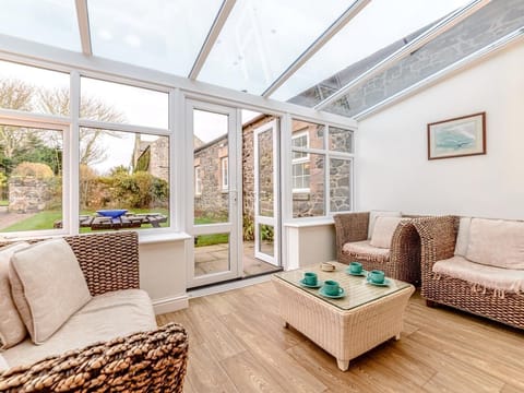 Relax in the cosy conservatory with a coffee 