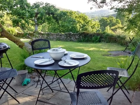 Enjoy far-reaching views from the patio of this characterful cottage