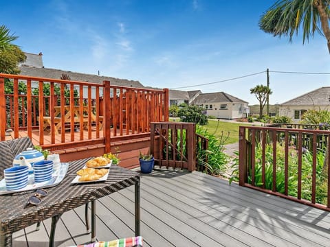 This well located holiday pad has an inviting decked area at the front, great for morning coffee