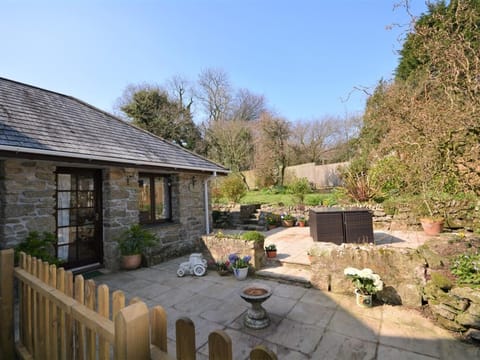 View towards the cottage and enclosed garden with seating