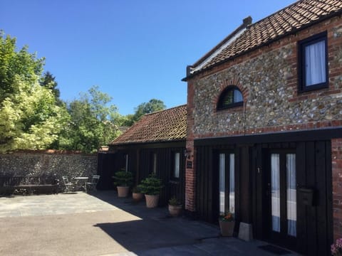 A former coach house situated in the heart of Holt