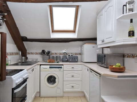 Well-equipped kitchen leading to open plan dining area