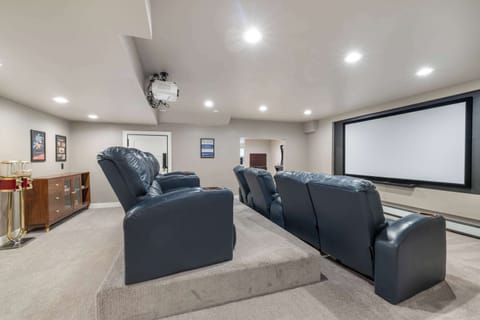 Watch your favorite movies on this big screen in one of the reclining chairs.

