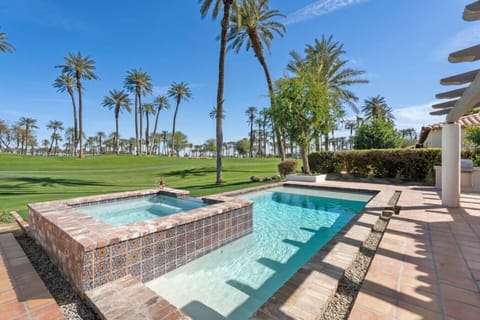 Backyard: pool & spa, large putting green, sun lounge chairs, outdoor kitchen area, Natural Gas Firepit, BBQ