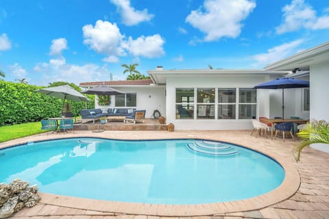 Private backyard pool with outdoor dining, lounge seating, and sunny space to unwind.