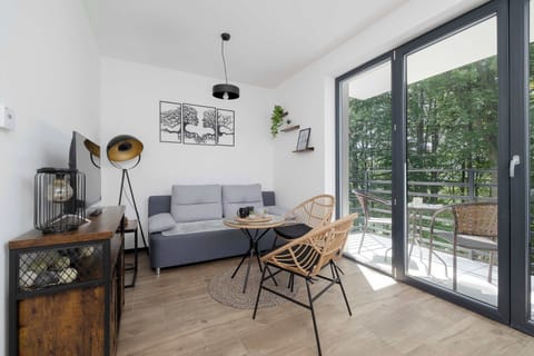 Relax in the stylish living room with a comfortable sofa and modern decor.