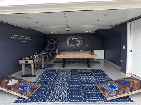 The ultimate garage game room for a little friendly competition—air hockey, foosball, basketball and shuffleboard, all in one space.