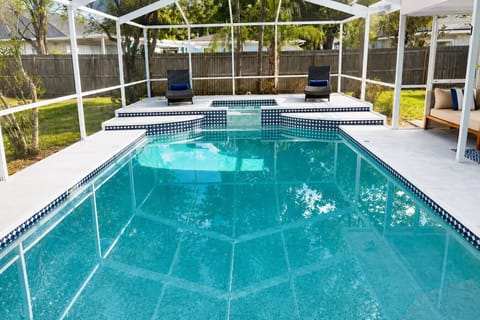 our own backyard oasis featuring a luxury heated pool and spa.