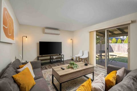 Bright living room with cozy seating and easy outdoor access.