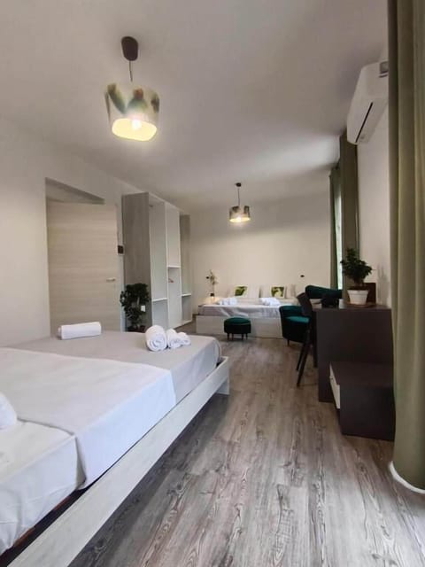 Deluxe Quadruple Room, Balcony, City View | Desk, laptop workspace, WiFi (free)