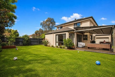 Enjoy a spacious lawn and cozy outdoor seating area.