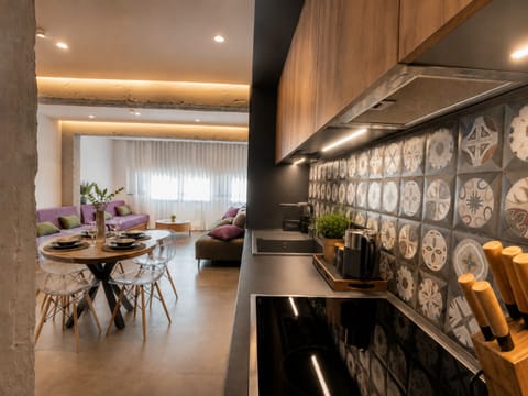 Deluxe Apartment | Private kitchen | Espresso maker, coffee/tea maker, full-size fridge, oven