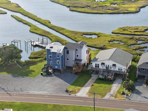 Aerial views showcase this beautiful retreat and its stunning soundside setting. 