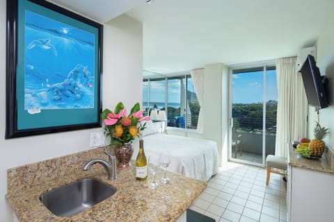Picture yourself unwinding in this bright, breezy space with coastal charm—enjoy your morning coffee at the granite counter before stepping onto your private balcony to soak in the views.