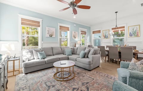 Enjoy breezy comfort under the ceiling fan as you relax on plush seating or gather at the dining table for meals together.