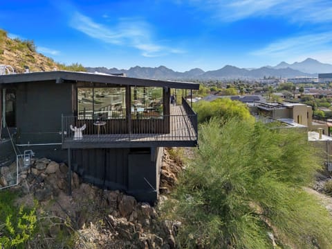 Hillside retreat with wraparound deck and sweeping mountain views