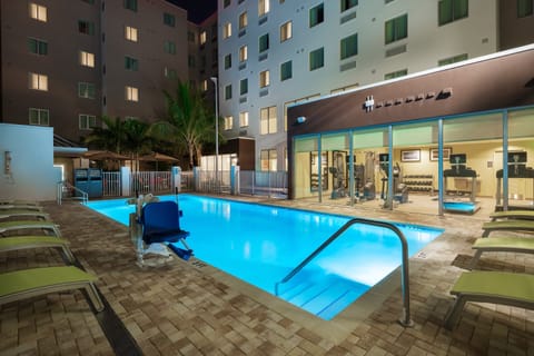 Take a refreshing dip in the shimmering pool, perfect for unwinding after a busy day.