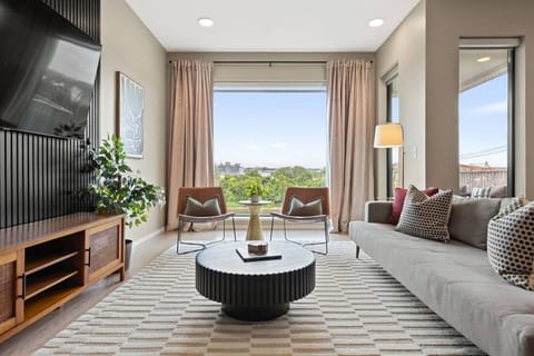 Bright and spacious living with comfortable seating and lots of natural light. Smart TV with all the streaming apps you could want. The couch turns into a sleeper sofa.