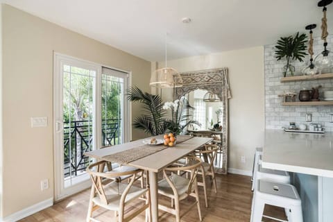 Dining area, seats 6 plus 4 barstools at counter.  Wishbone chairs and custom built table.  Standing mirror that we finished and stained ourselves.  