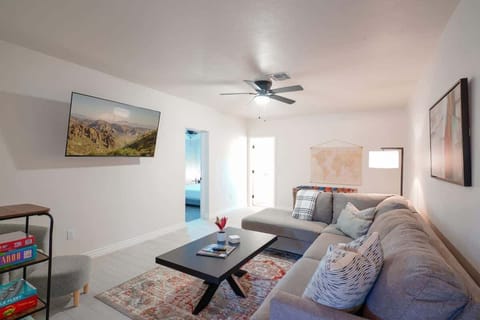 Cozy living room with 58" Smart TV.