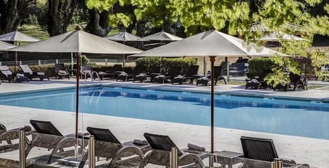 Spacious sun terraces border the pool, offering the perfect spot to relax under the Provence sky after a round on the estate's award-winning golf course.