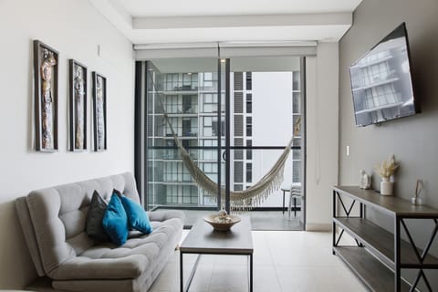 Deluxe Apartment, Balcony, Beach View | Living area | 40-inch flat-screen TV with digital channels
