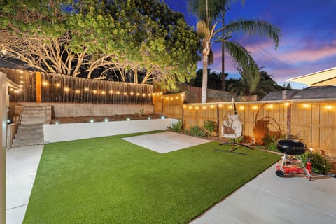A spacious backyard with a private putting green and plenty of room to relax