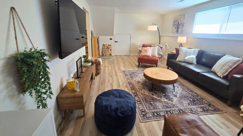 Bright family room with Smart TV and comfortable seating for everyone.